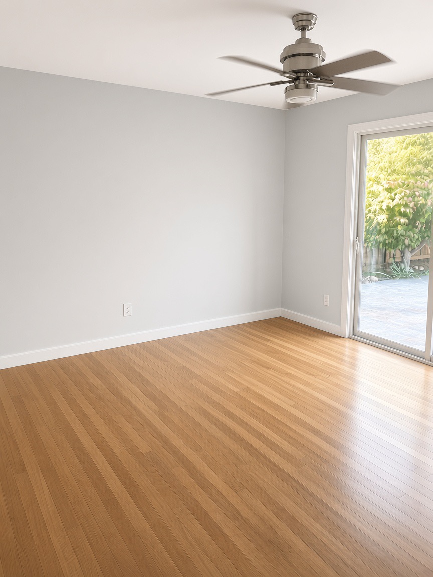 Bedroom with light blue walls, a ceiling fan, hardwood floors, and a sliding glass door to the patio